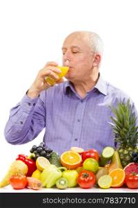 mature man juice and standing next to fruits and vegetables isolated on white. mature man juice