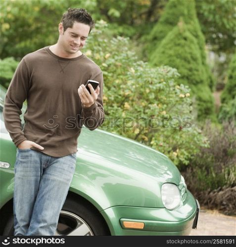Mature man looking at a mobile phone and smiling
