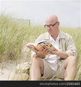 Mature man reading a book