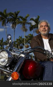 Mature man sitting on a motorcycle