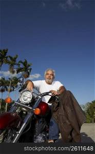 Mature man sitting on a motorcycle