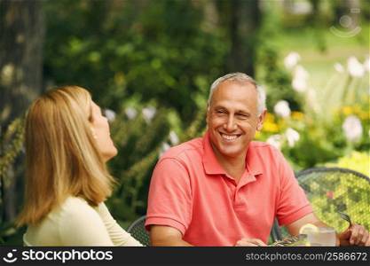 Mature man smiling with a mid adult woman