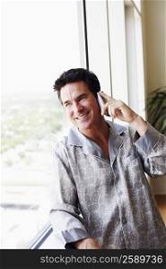 Mature man standing talking on a mobile phone