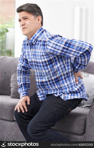 Mature Man Suffering From Backache At Home