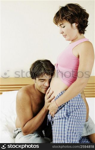 Mature man touching the abdomen of a mature woman