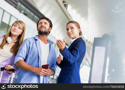 Mature man traveling with her sister while asking for assistance with the airport staff