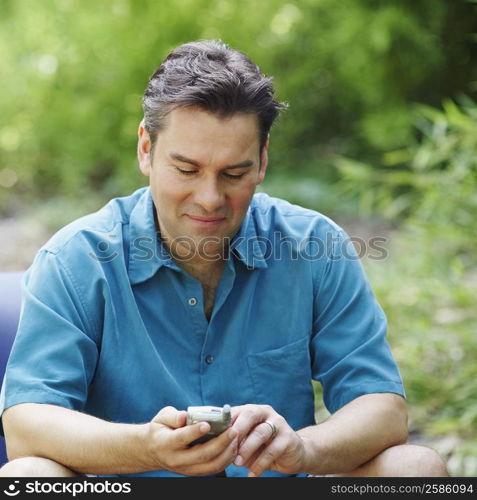 Mature man using a mobile phone