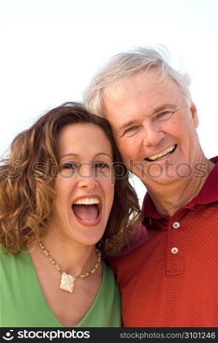 Mature man with mid adult woman, laughing