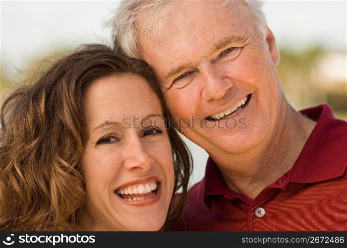 Mature man with mid adult woman, smiling