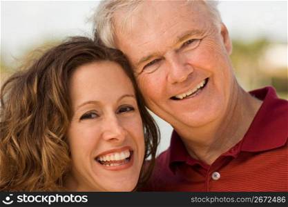 Mature man with mid adult woman, smiling