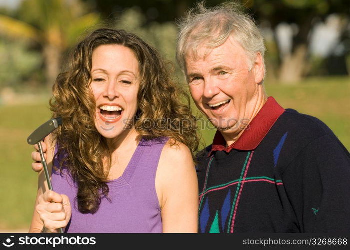 Mature man with mid adult woman, smiling