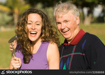 Mature man with mid adult woman, smiling