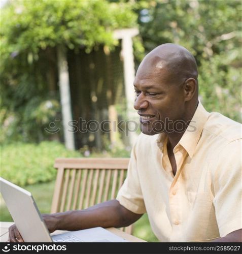 Mature man working on a laptop