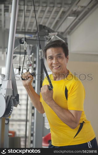 Mature man working out in the gym, portrait