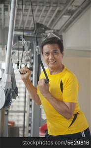 Mature man working out in the gym, portrait
