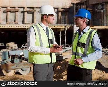 Mature men meeting on construction site
