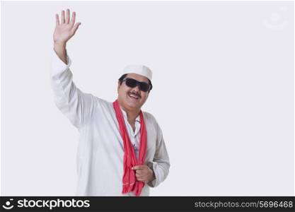 Mature politician greeting over white background