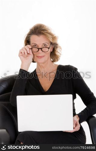 Mature secretary with laptop