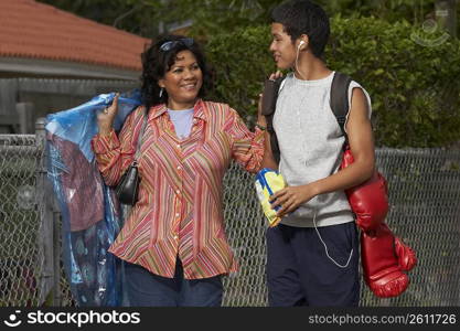 Mature woman and her son standing and talking