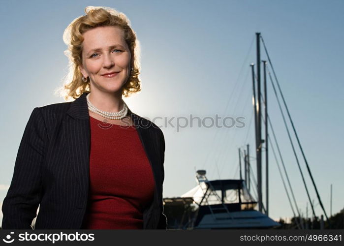 Mature woman by yacht