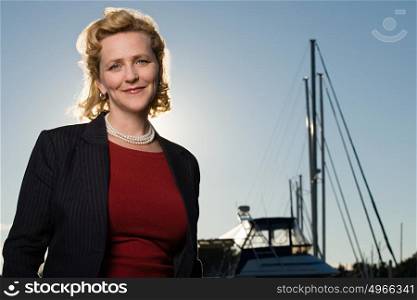 Mature woman by yacht