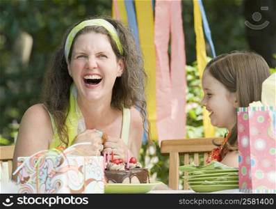 Mature woman celebrating birthday with her daughter