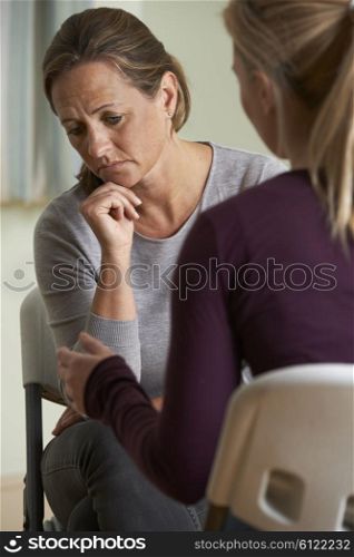 Mature Woman Discussing Problems With Counselor