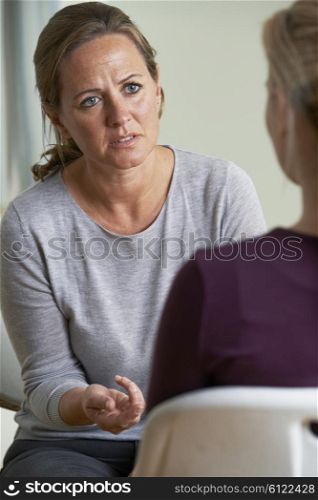Mature Woman Discussing Problems With Counselor