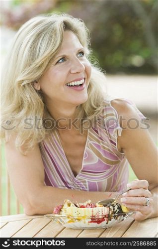 Mature woman eating an ice cream