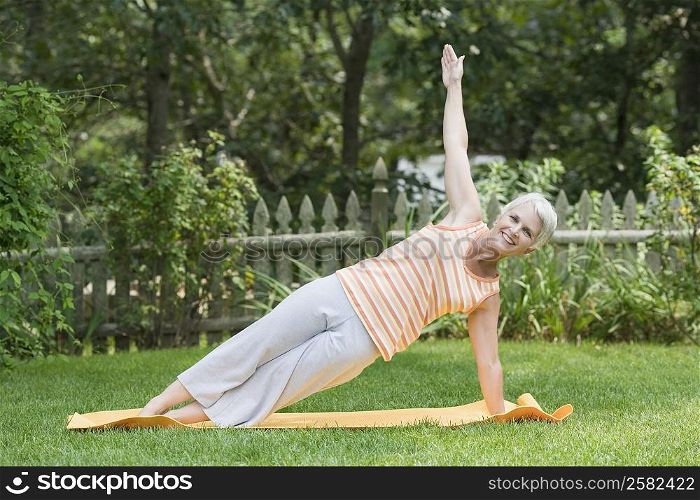 Mature woman exercising in a park