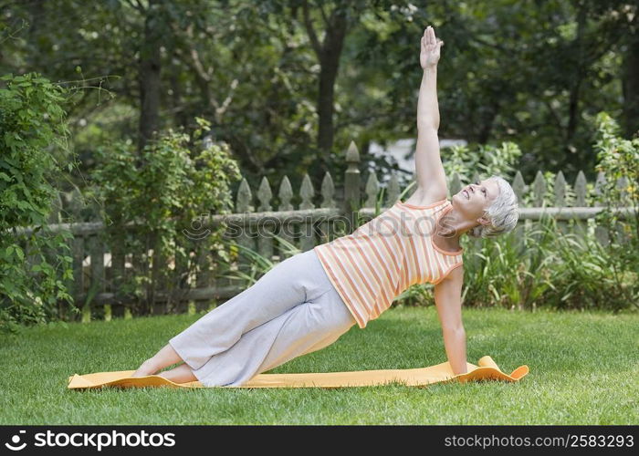 Mature woman exercising in a park