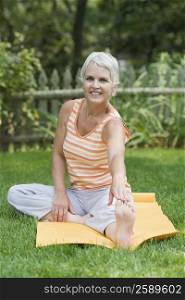 Mature woman exercising in a park