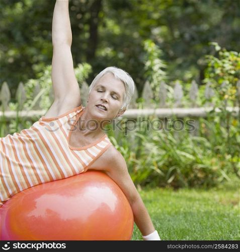 Mature woman exercising with a fitness ball