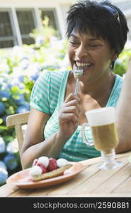 Mature woman having breakfast