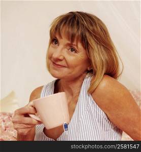 Mature woman holding a cup of tea