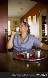 Mature woman holding a cup of tea