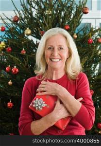 Mature woman holding a gift