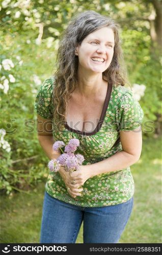 Mature woman holding flowers