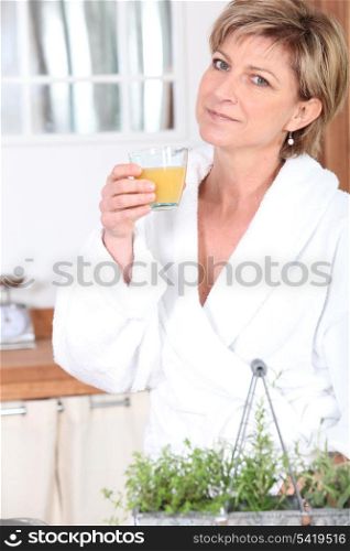 Mature woman in bathrobe