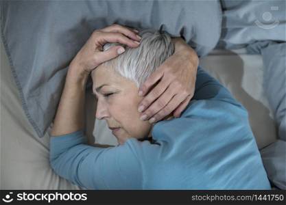 Mature Woman in Bed, Staying Awake Late at Night, Having Sleeping Problems