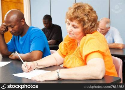 Mature woman in diverse adult education class.