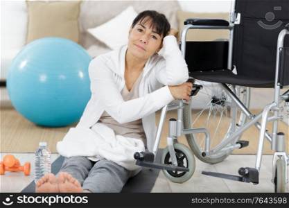 mature woman in wheelchair during rehabilitation