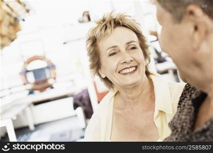 Mature woman looking at a senior man and smiling