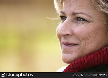 Mature woman looking away smiling