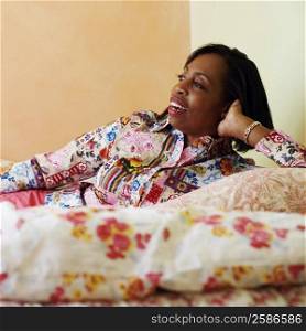 Mature woman lying on the bed