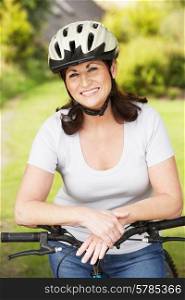Mature Woman On Cycle Ride In Countryside