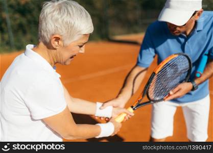 Mature Woman Playing Tennis