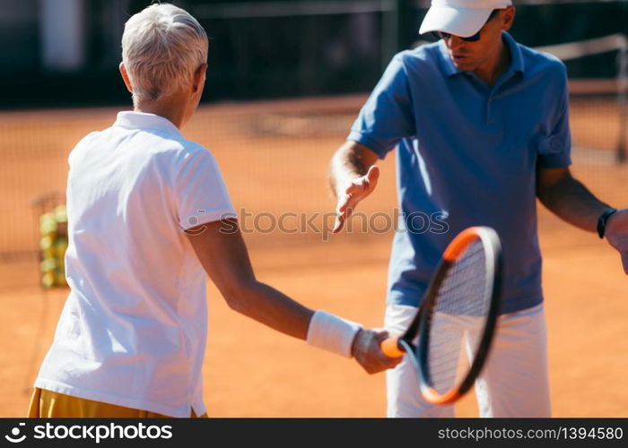 Mature Woman Playing Tennis