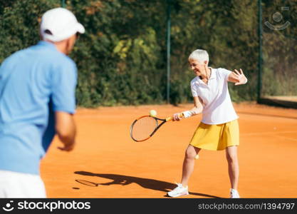 Mature Woman Playing Tennis