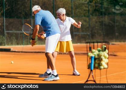 Mature Woman Playing Tennis